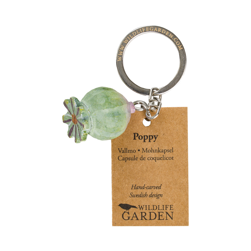 Ręcznie rzeźbiony drewniany brelok do kluczy w kształcie maku, zielony z napisem "Poppy" w wielu językach - szwedzki projekt Wildlife Garden.